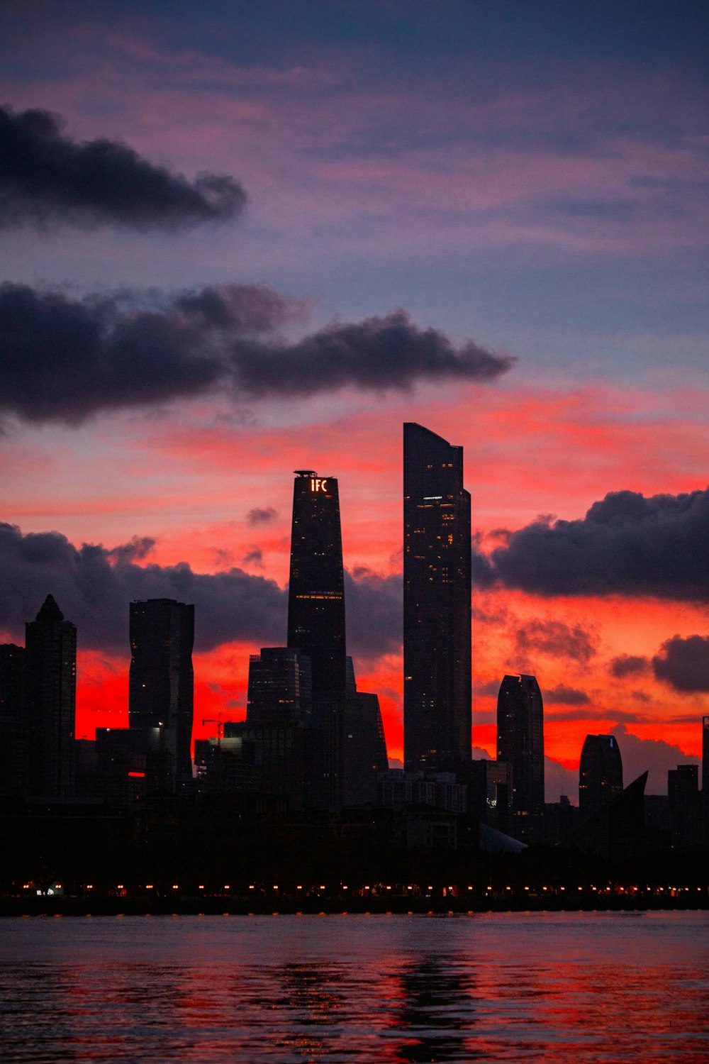 silhouette of city buildings during sunset