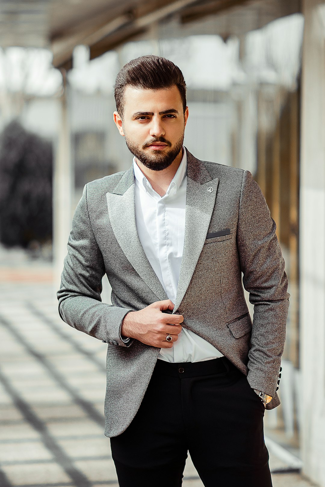 man in gray suit jacket and black dress pants