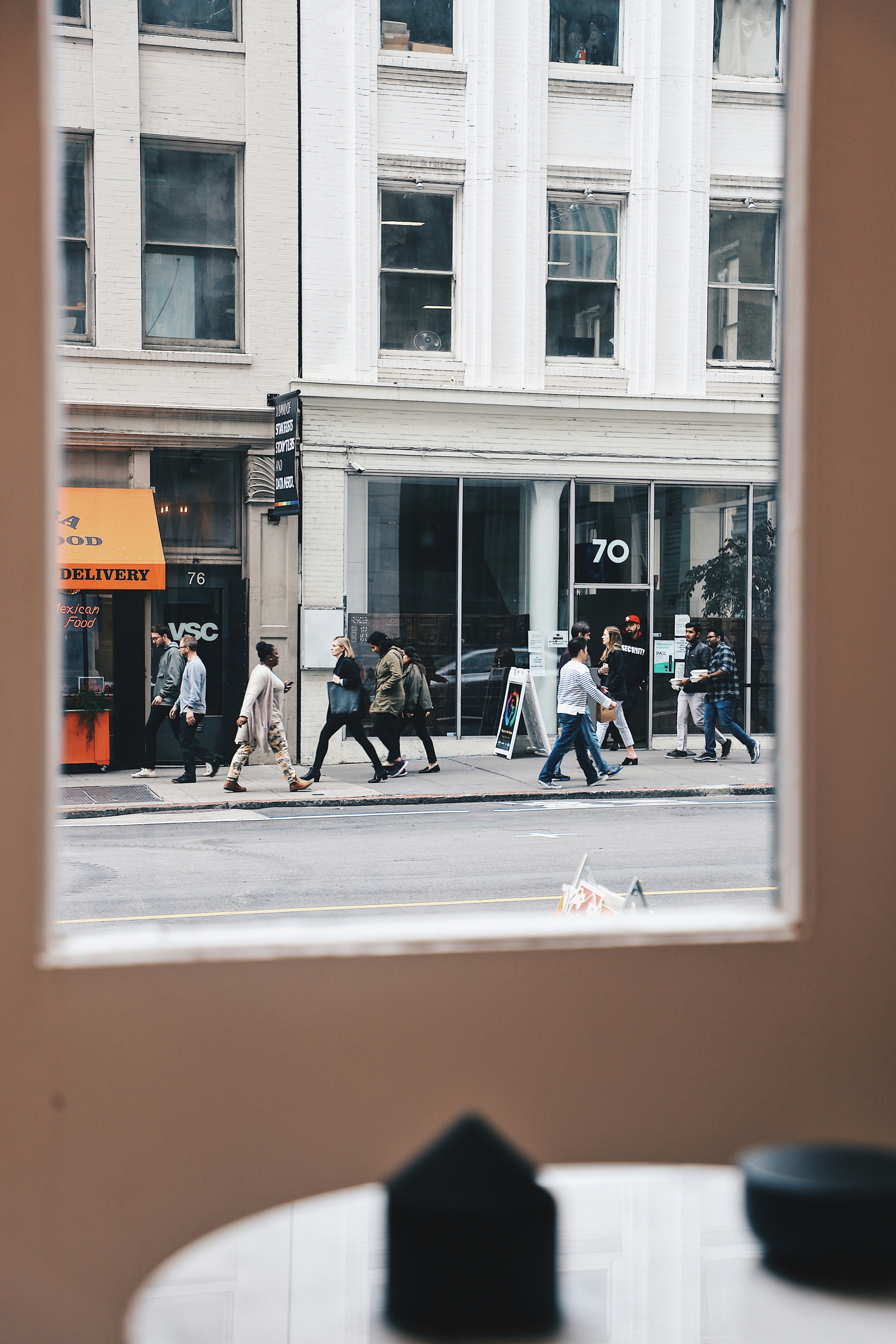 People walking on sidewalk near building during daytime - lunch break history walks