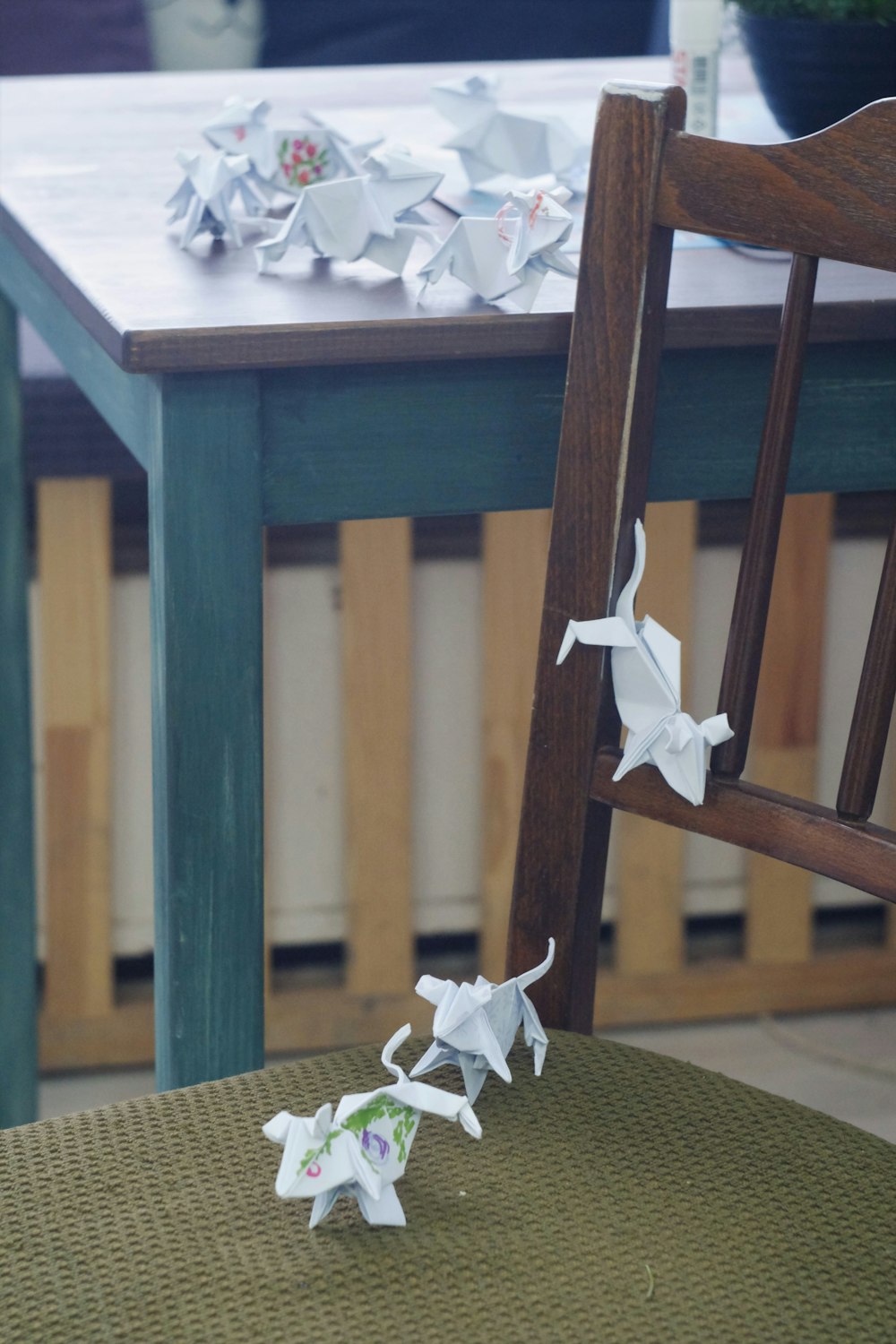 white and brown wooden table with white flower