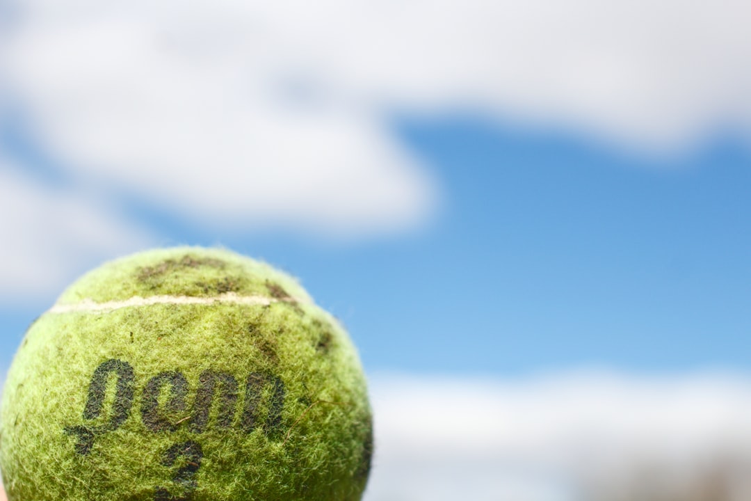 green tennis ball in close up photography