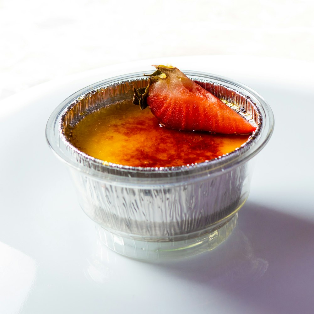 clear glass bowl with brown liquid