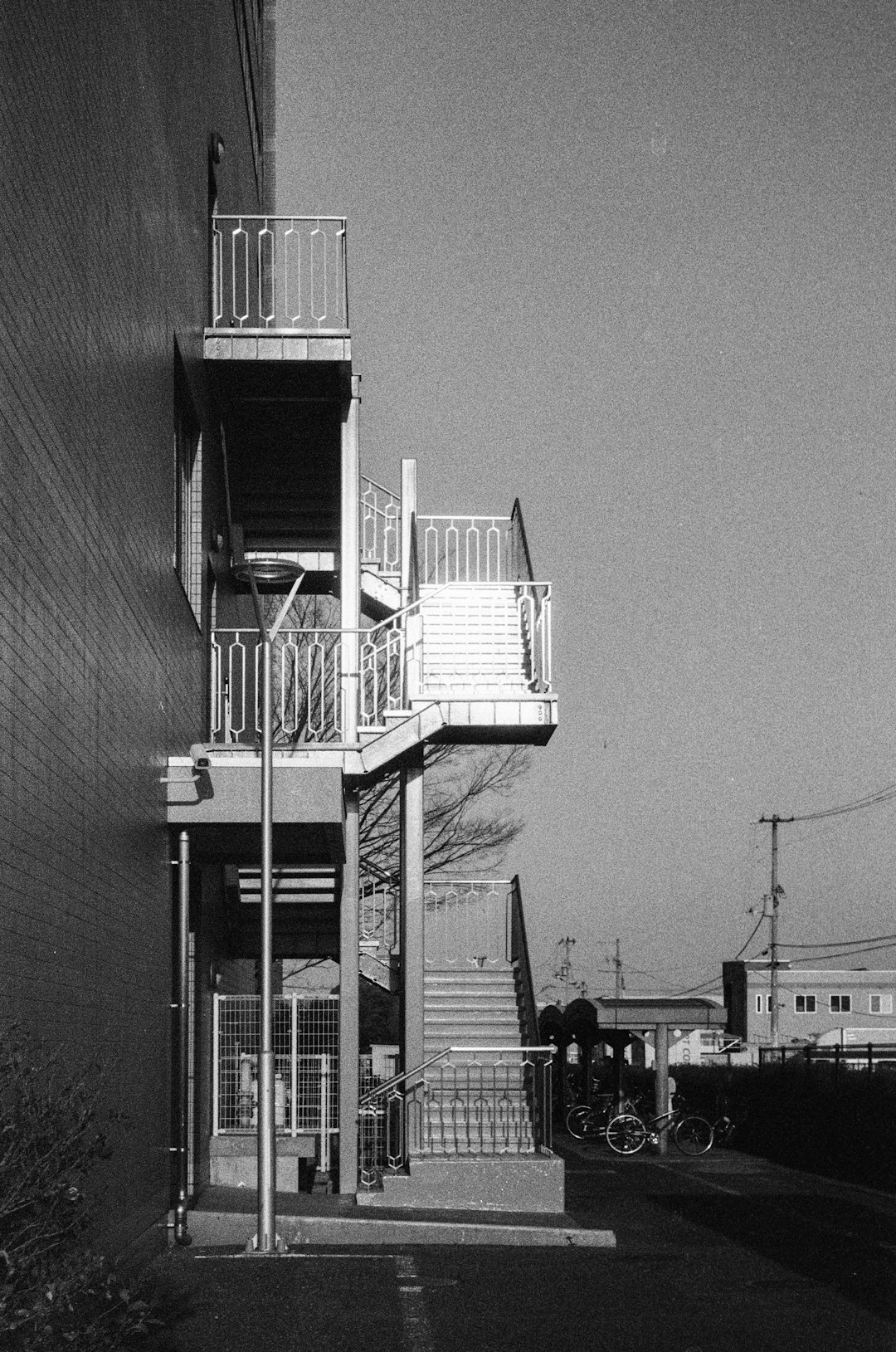 grayscale photo of building with stairs