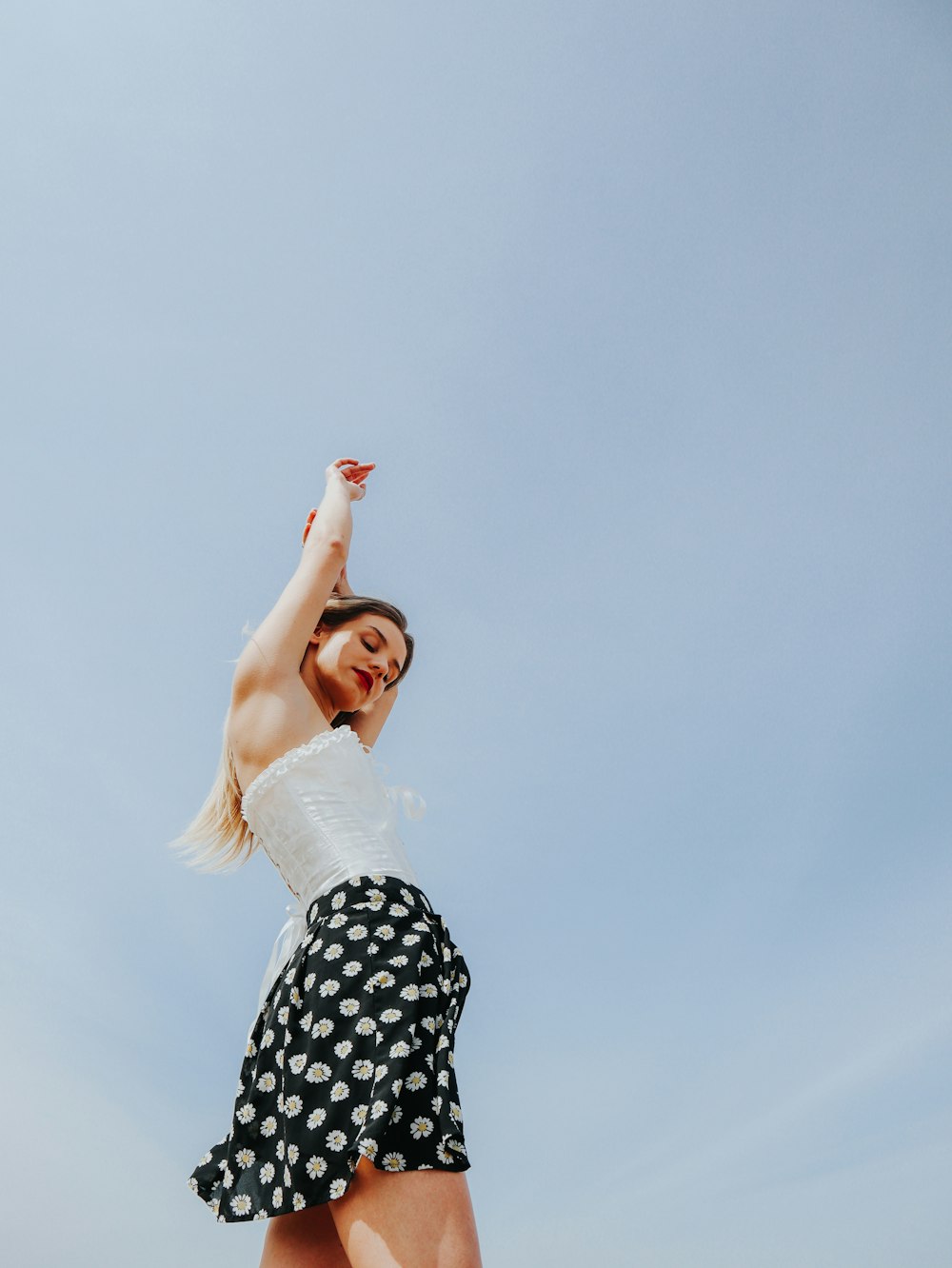 Woman in white shirt and black and white polka dot skirt photo – Free Canada  Image on Unsplash