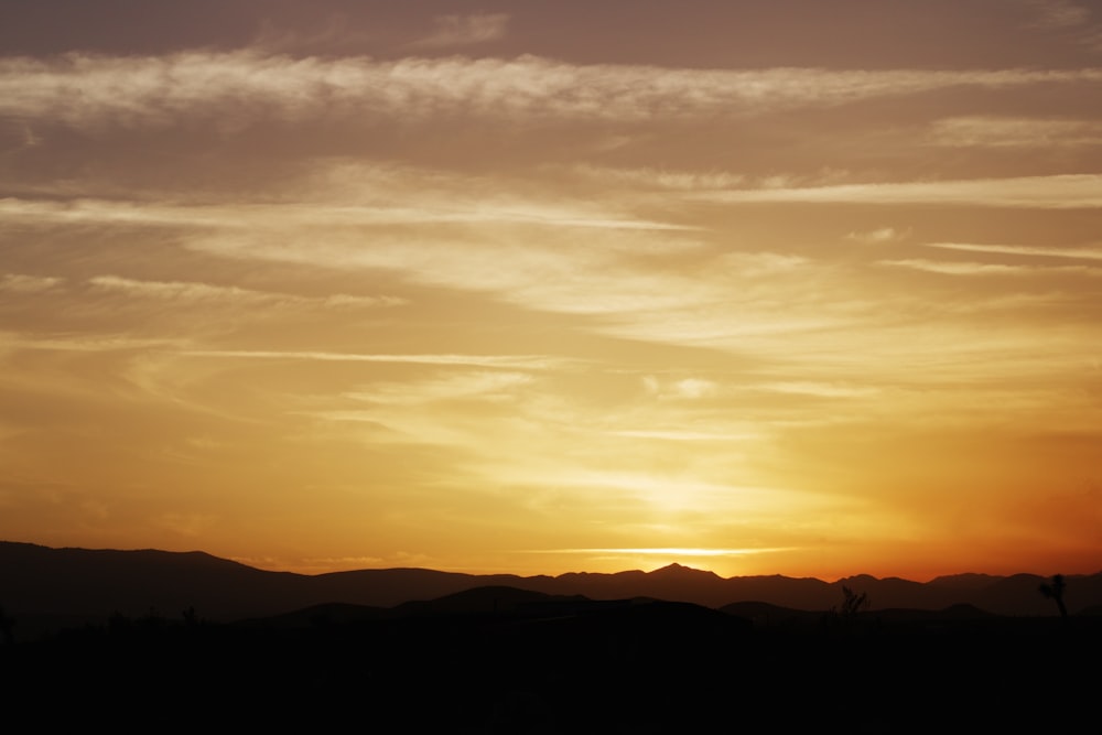 silhouette of mountain during sunset