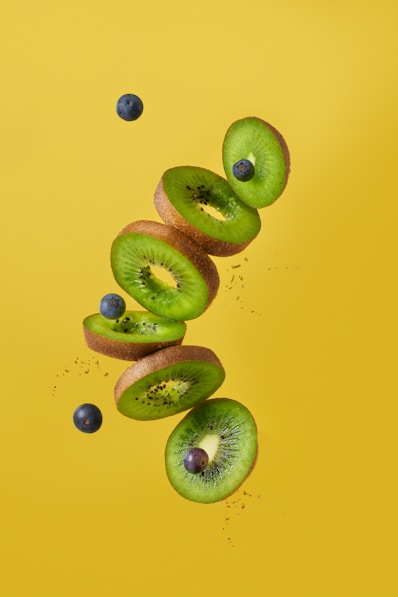 green and brown fruits on blue surface