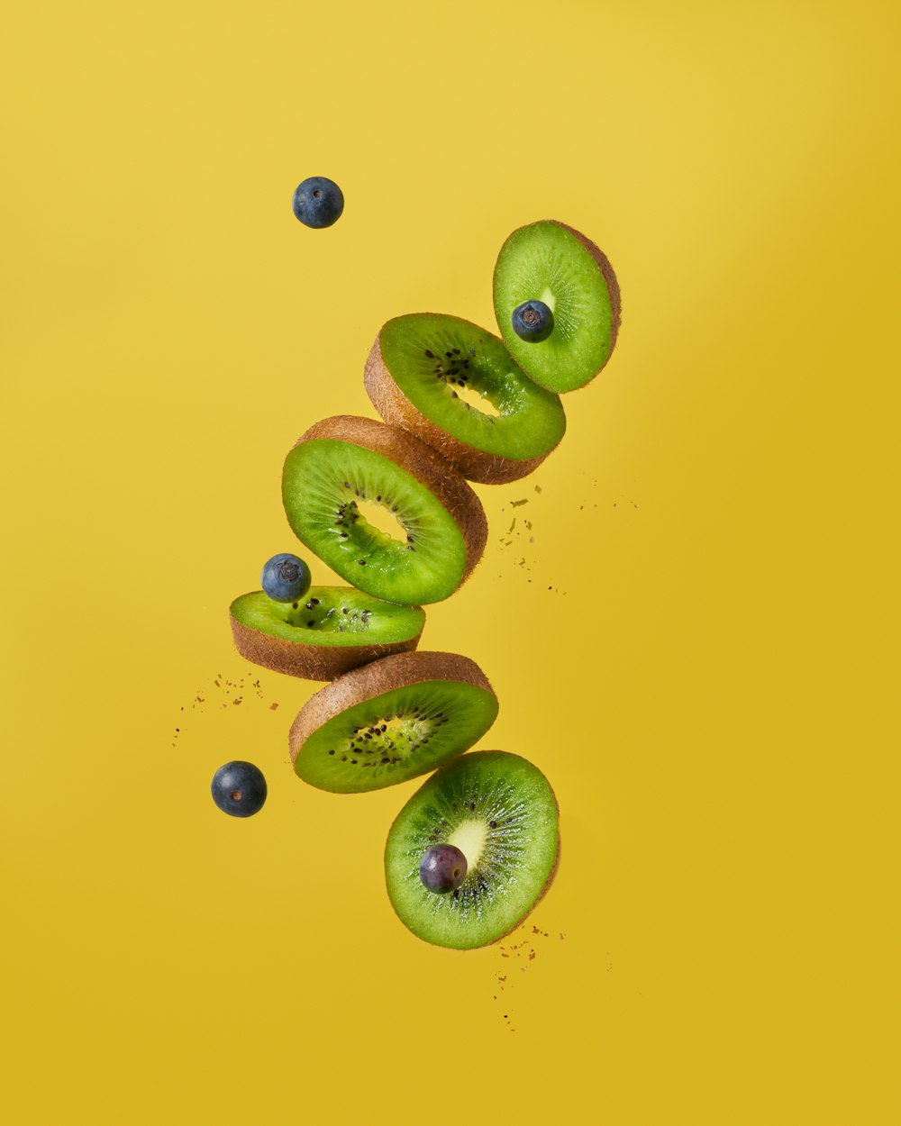 green and brown fruits on blue surface
