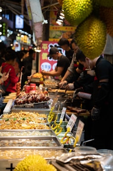 people standing in front of food stall during daytime