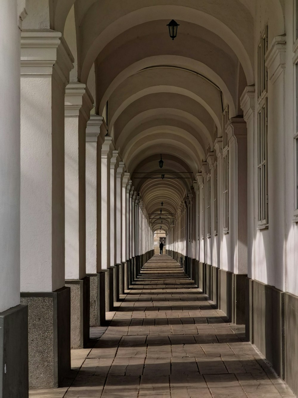 white and brown hallway with no people