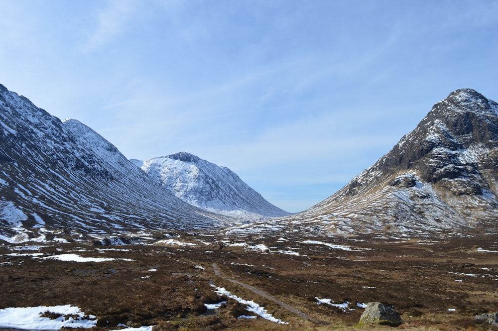 gray mountain under blue sky during daytime