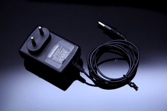 black usb cable on white surface