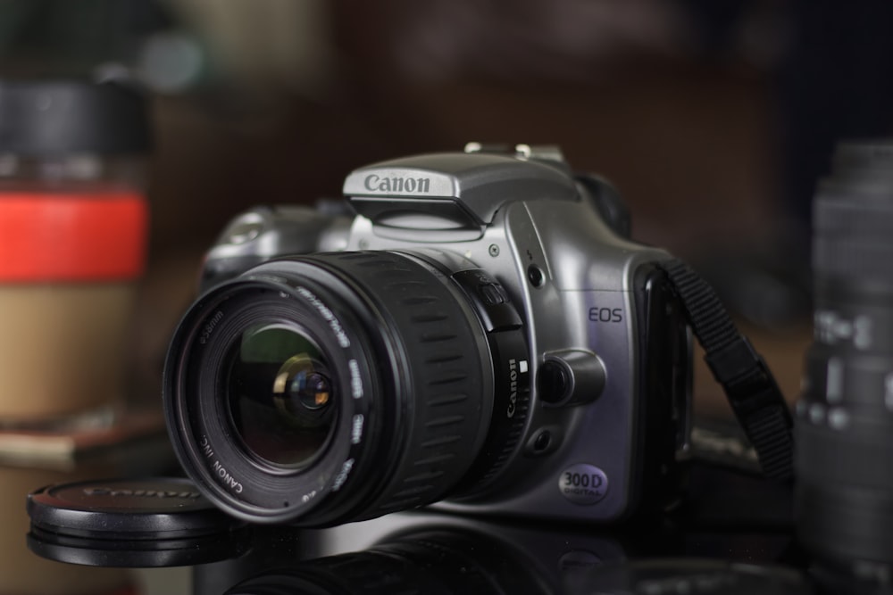 black and silver canon dslr camera