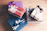 A beautifully wrapped éclatvive gift box with a delicate ribbon on a wooden table.