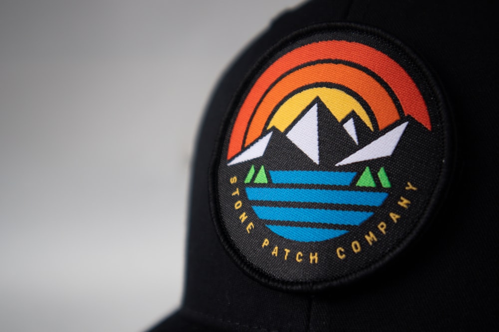 black orange and blue fitted cap