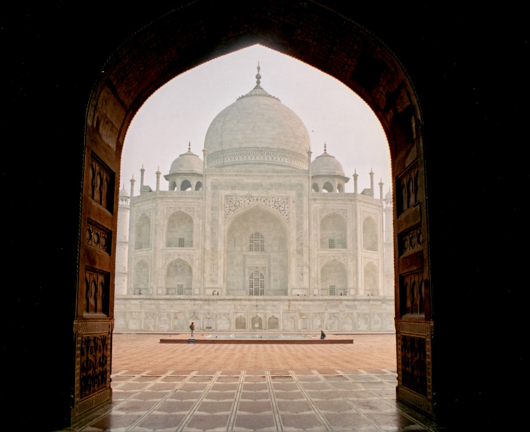 brown and white concrete building, Scan of 35mm film photograph of Taj Mahal
