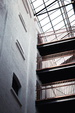 Interior view of Studio Paolina 1 showcasing exposed brick walls and vaulted ceilings.