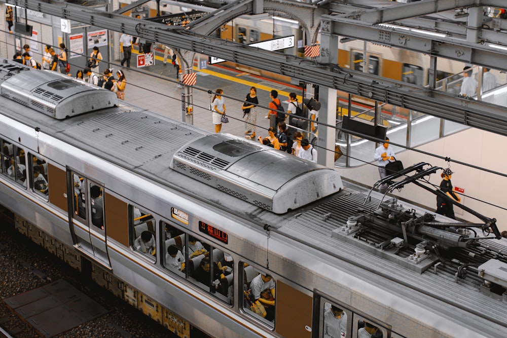 people standing beside train during daytime