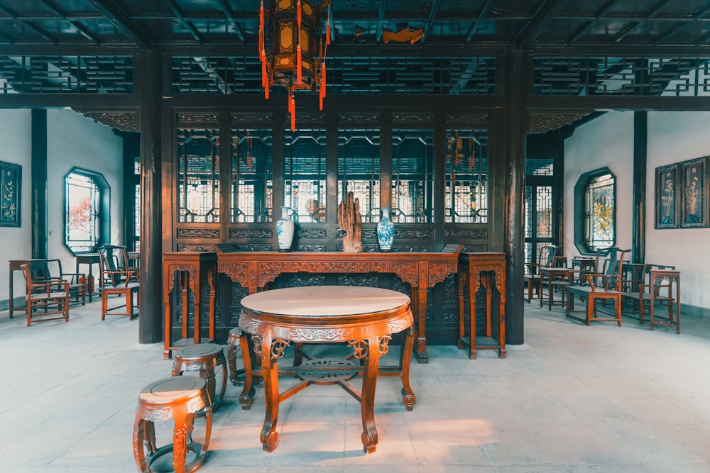 brown wooden table and chairs inside building