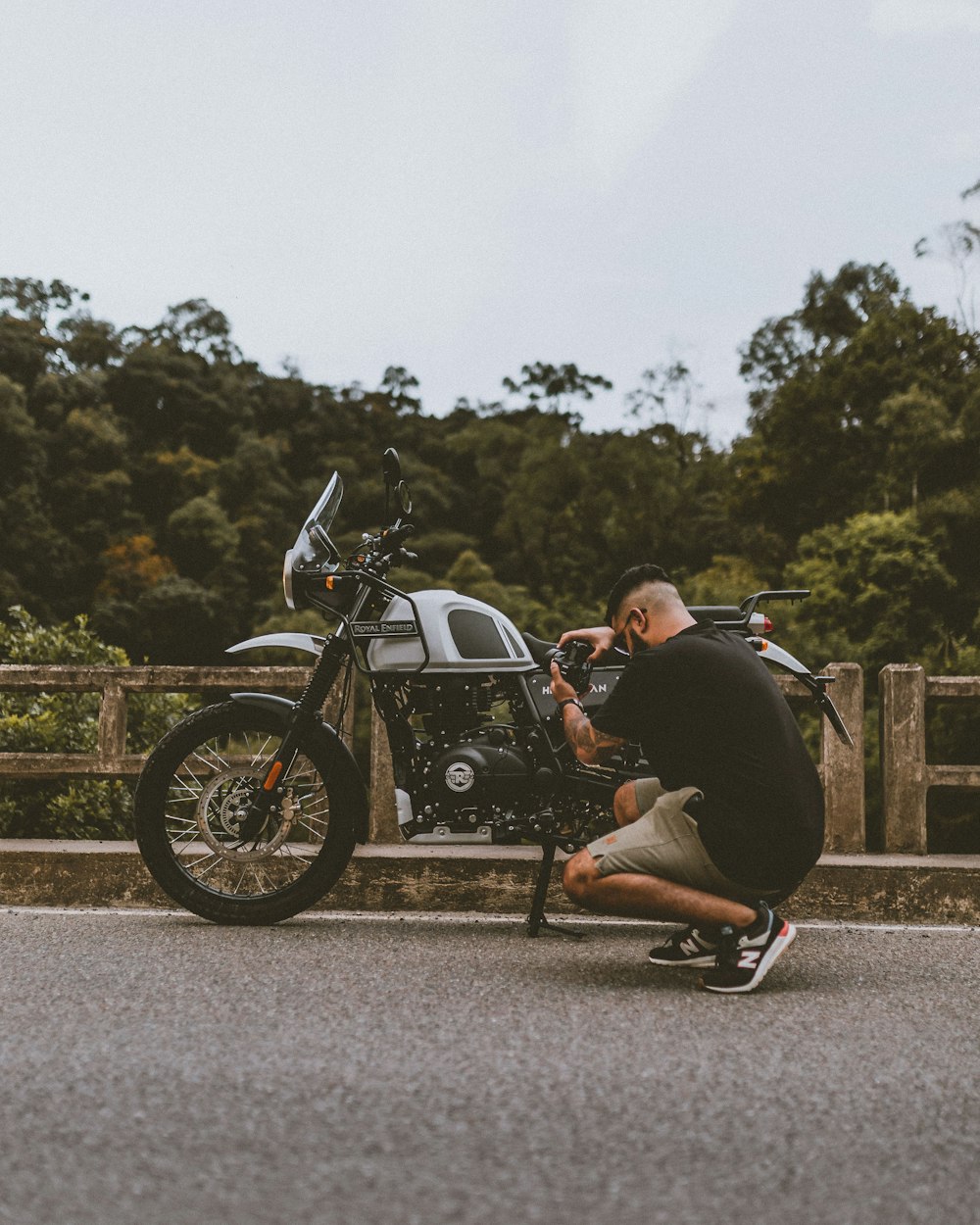 man in black jacket riding black cruiser motorcycle