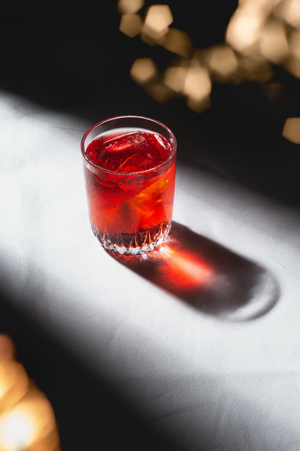 clear drinking glass with red liquid