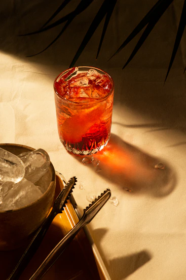 Close-up of a burgundy red cocktail in a clear glass