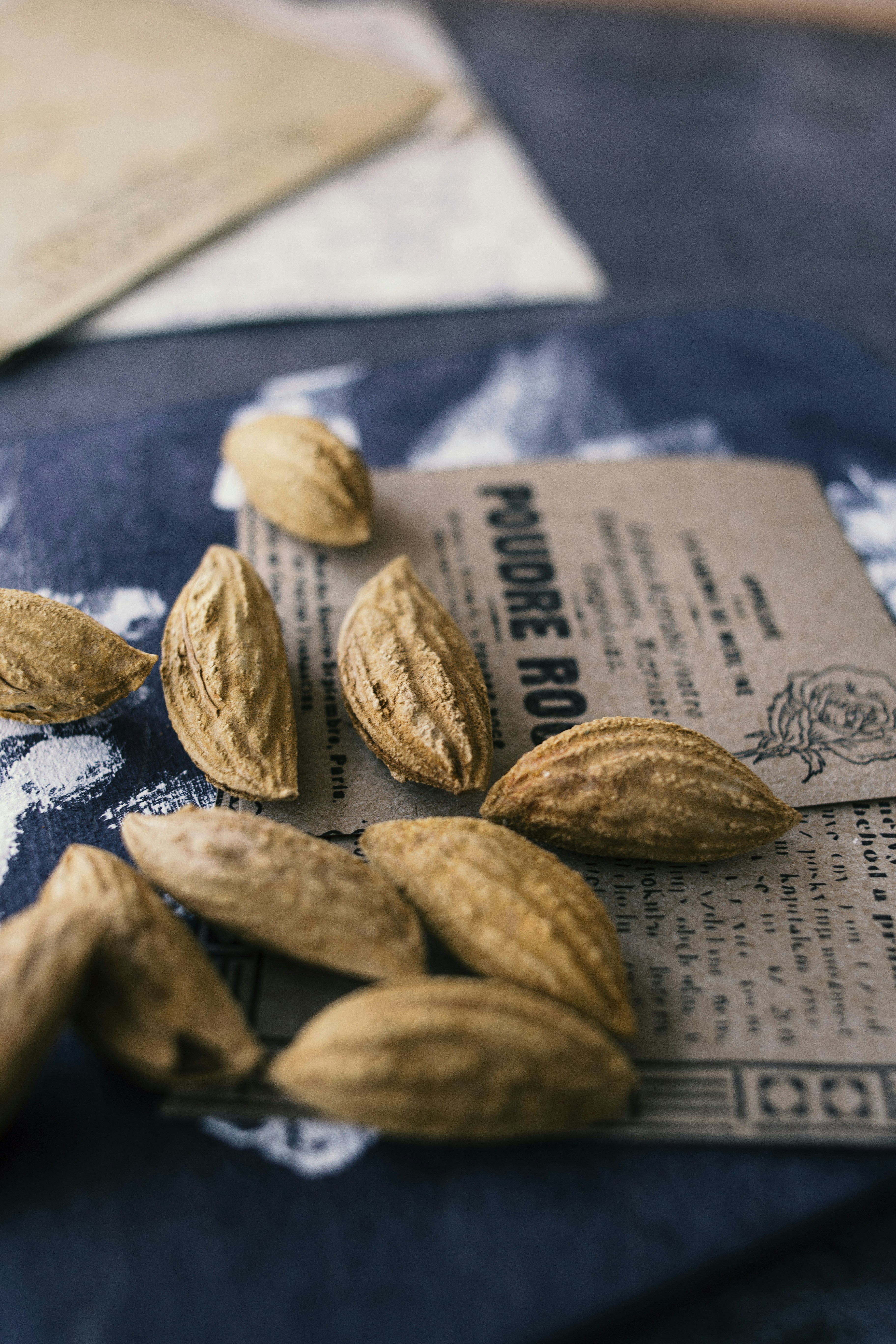 brown nut on white paper