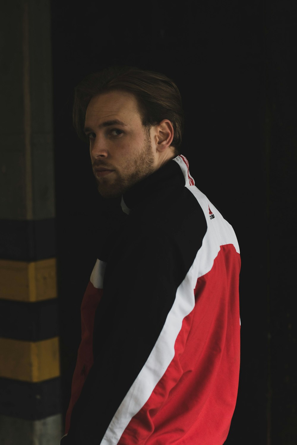 man in black and white jacket