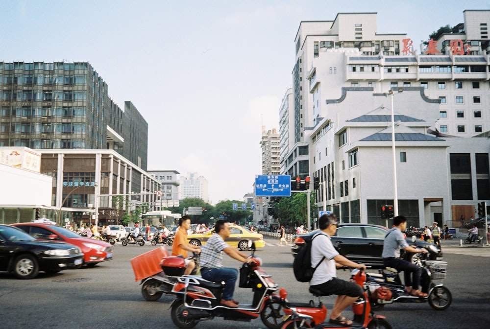 people riding motorcycle on road during daytime