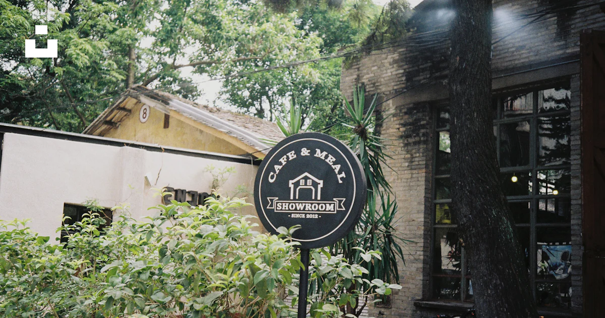 Outside Simbolo A sign that is outside of a building photo – Free Outdoors Image on ...