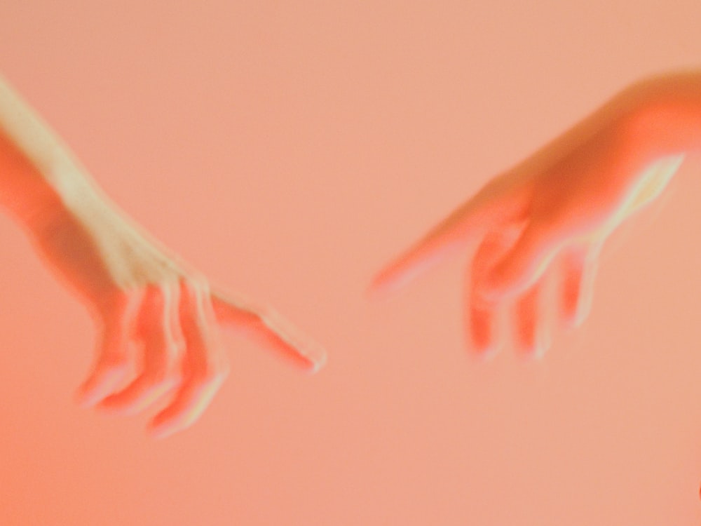 persons left hand on blue textile