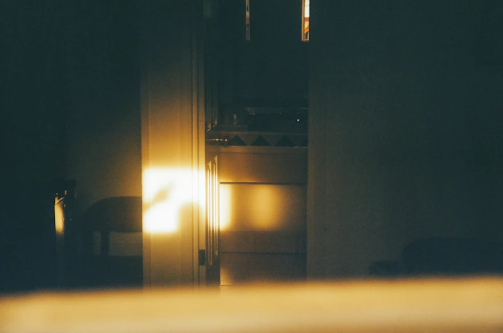 A photorealistic render of a sunlit interior space highlighting natural light and shadows.