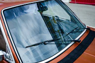 black car door with white window blinds