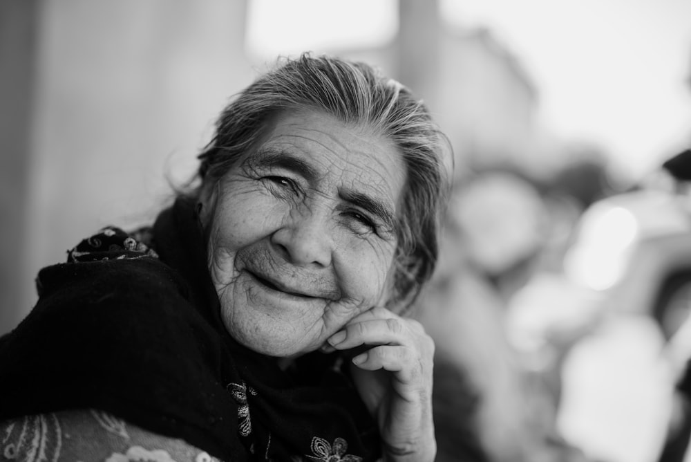 grayscale photo of woman smiling