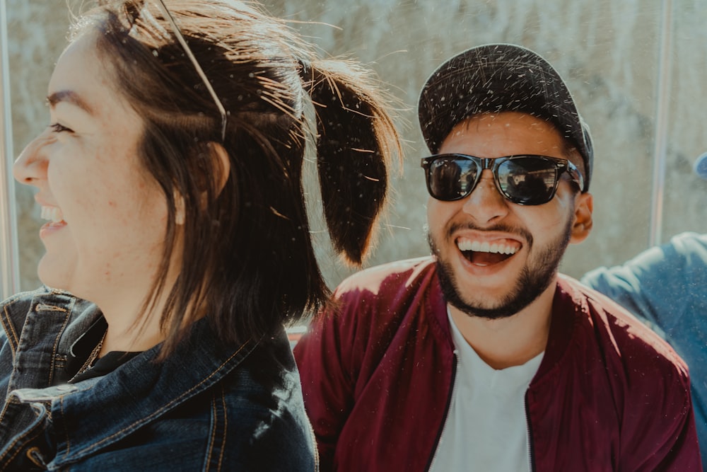 man in black leather jacket wearing black sunglasses