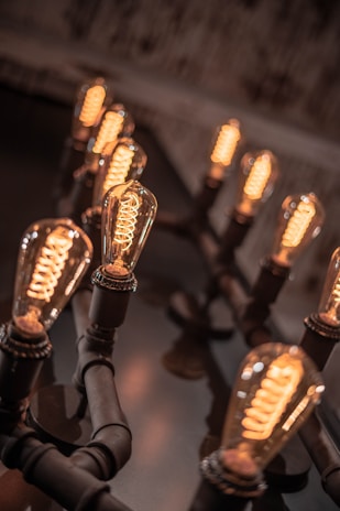 brown and black bottles on black wooden rack