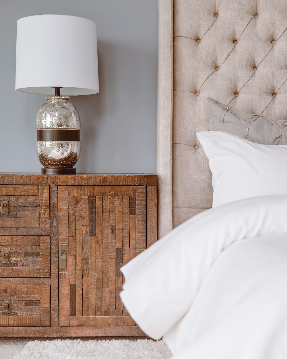 white table lamp on brown wooden drawer