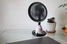 white and black desk fan