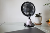 white and black desk fan
