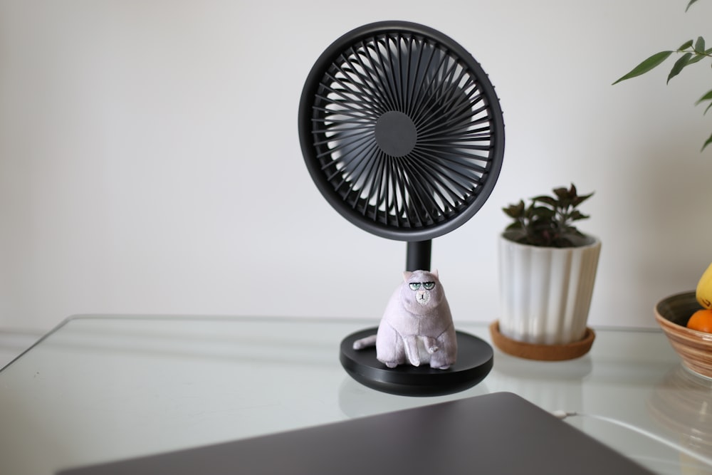 white and black desk fan
