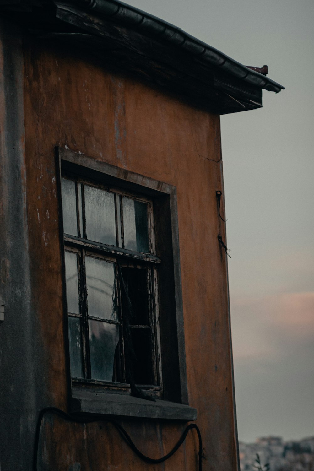 brown wooden framed glass window