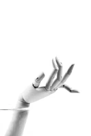 A finished silicone prosthetic hand displayed on a minimalist white stand.
