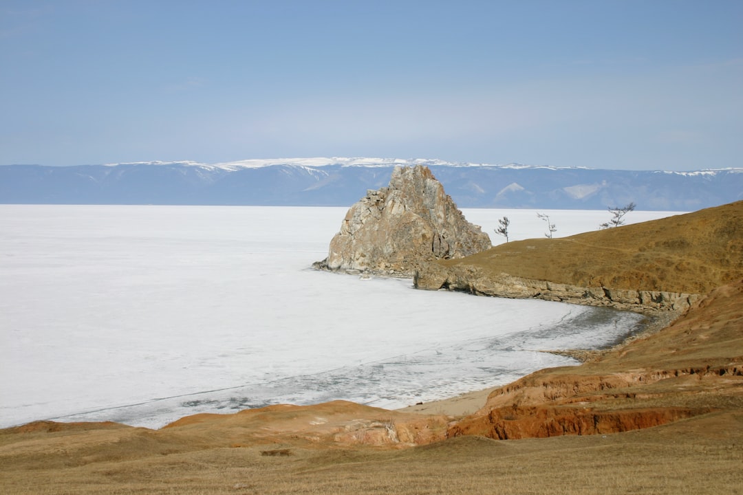 brown rock formation on sea during daytime