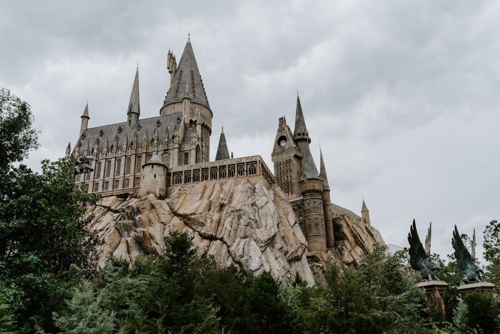 brown concrete castle under white clouds during daytime