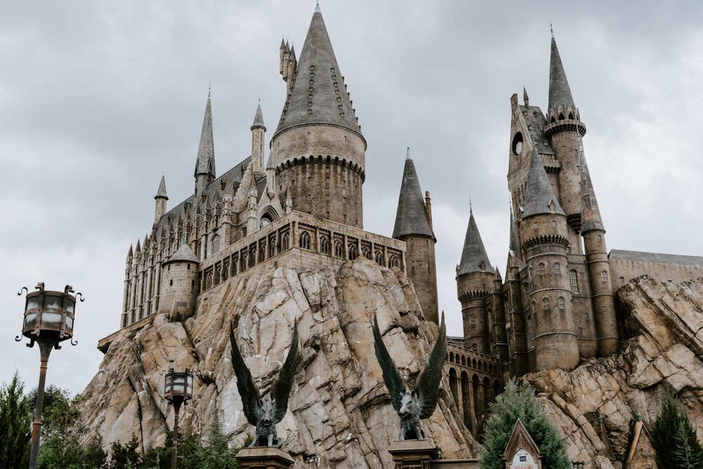 brown concrete castle under white clouds during daytime