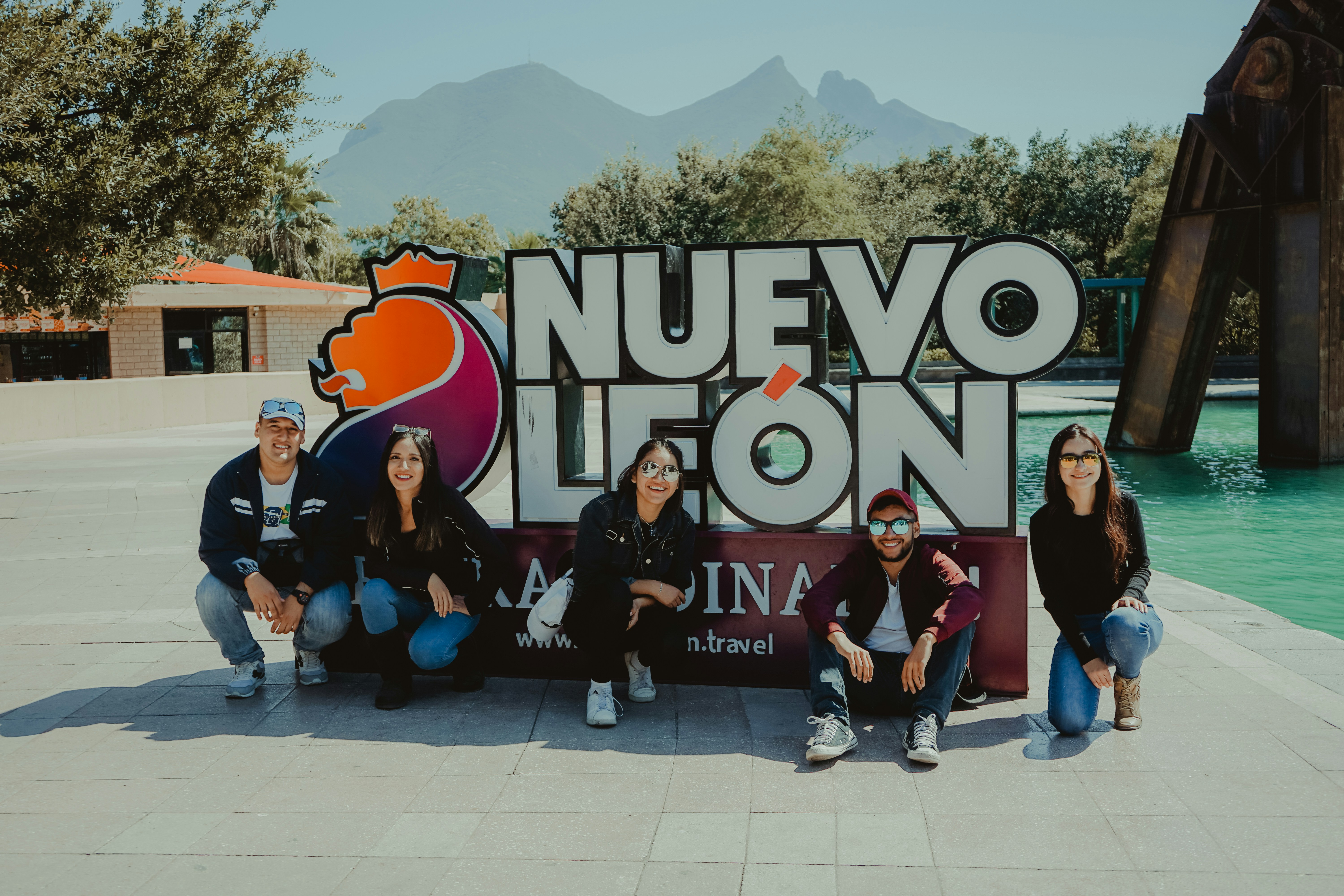 group of people standing on white floor tiles