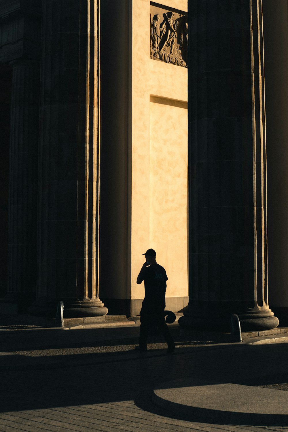 silhouette of person standing on concrete floor