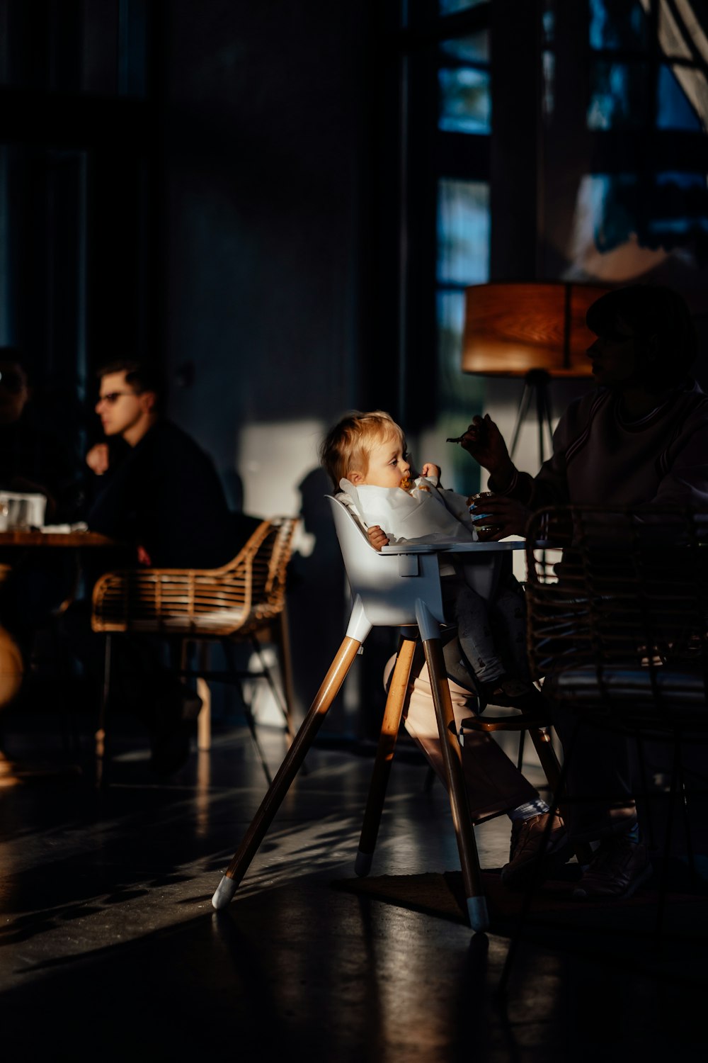 man and woman sitting on chair