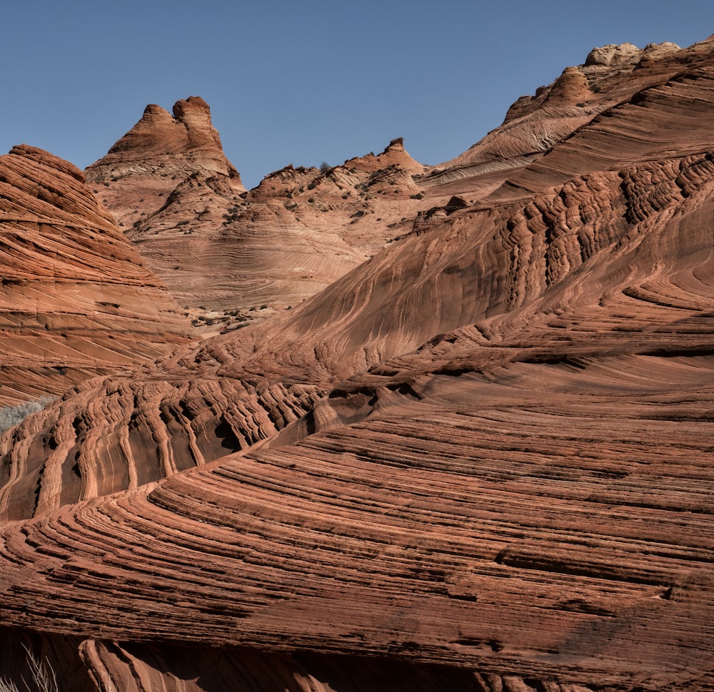 brown rock formation under blue sky during daytime