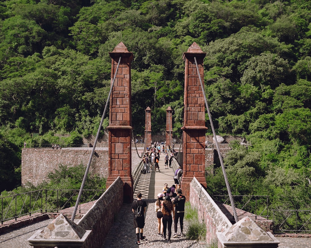 people walking on bridge during daytime