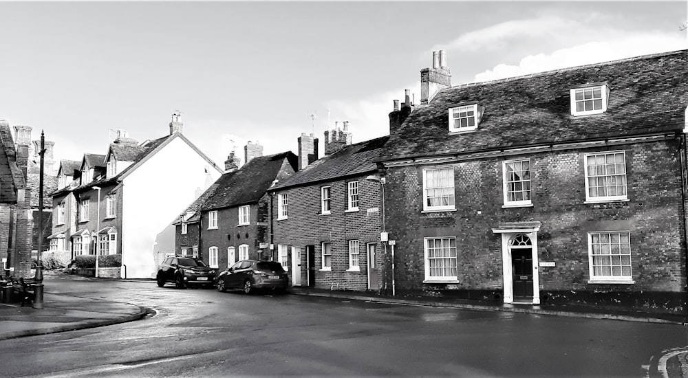 grayscale photo of 3 storey house